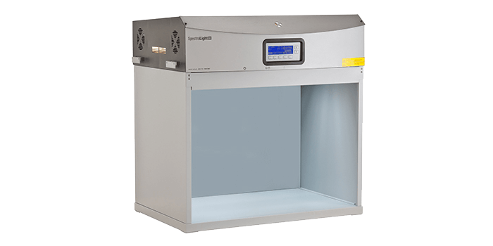 A hallowed gray box called a light booth, or lighting box, with a large blue control panel. The X-Rite is on the side. 