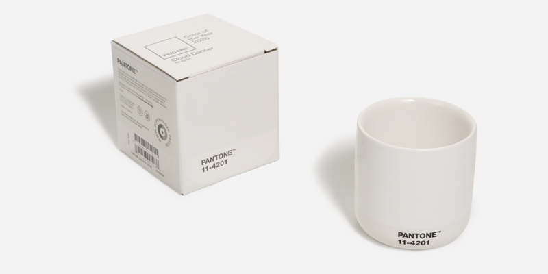 Product packaging and a mug printed in the PANTONE Color of the Year 2026, Cloud Dancer, illustrating how substrate and ink control impact white reproduction in packaging.
